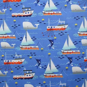 Coton imprimé l'océan et ses bateaux fond bleu