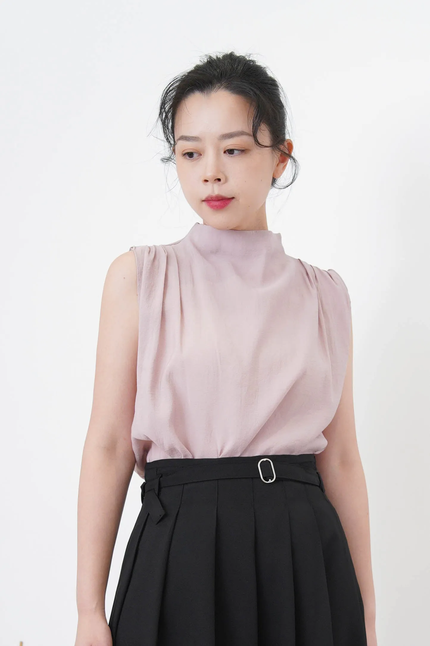 Pink high neck blouse in pleats shoulders