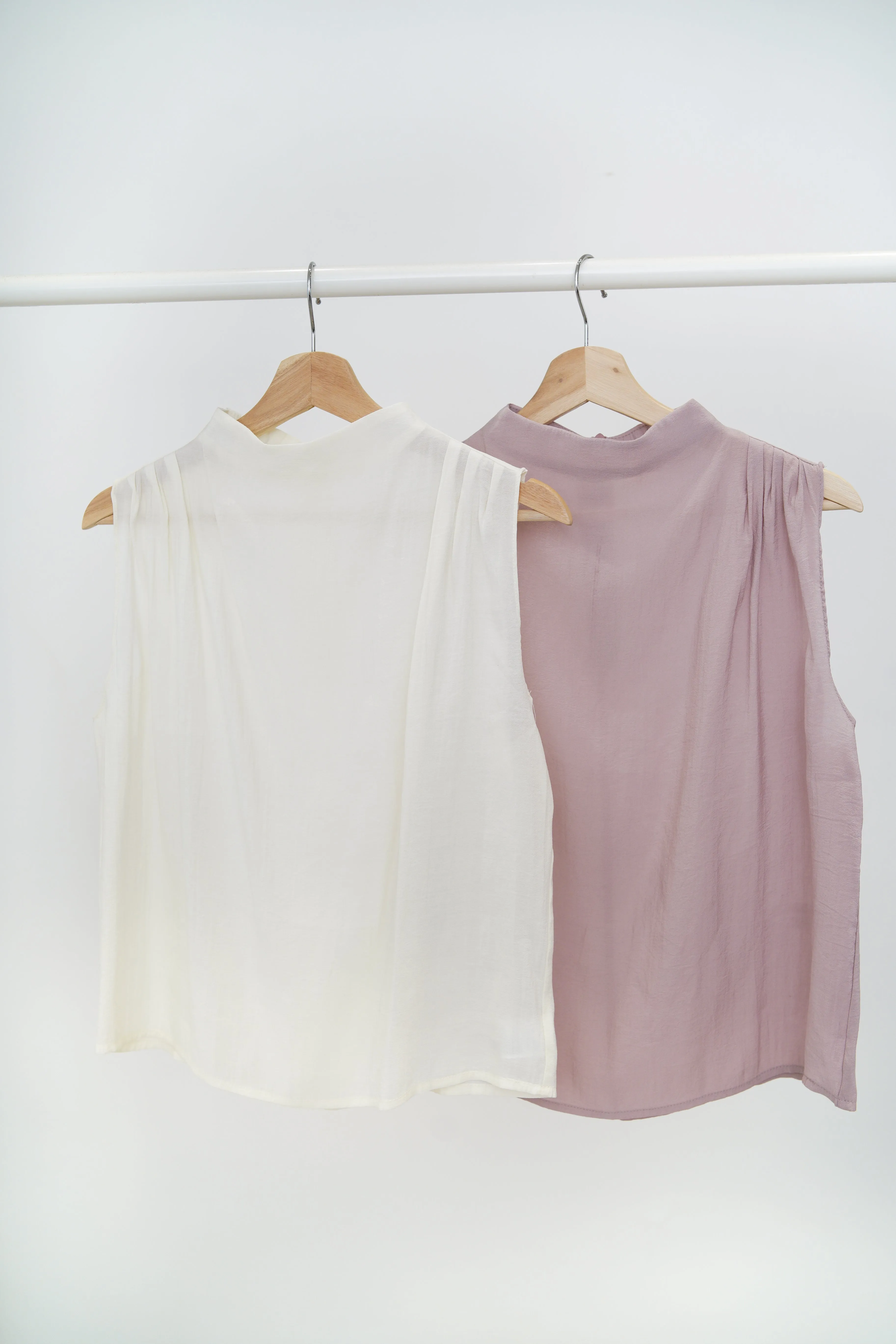 Pink high neck blouse in pleats shoulders